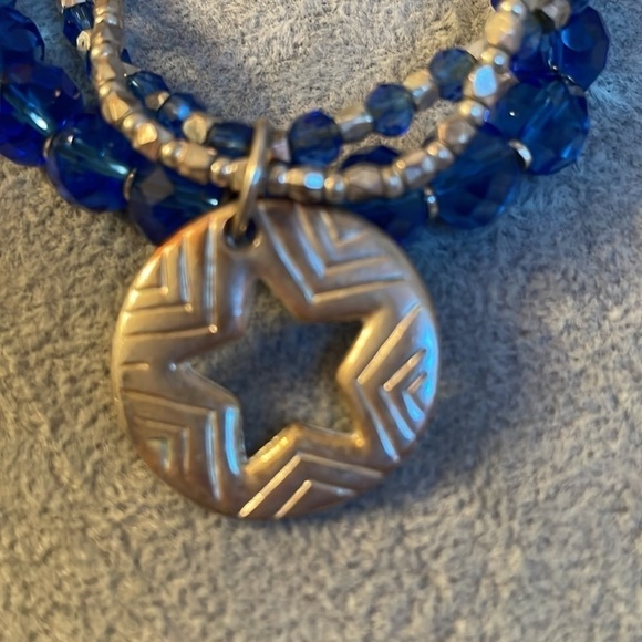 Set of 3 connected blue and silver jewel like bracelets with a star charm. - Picture 4 of 5